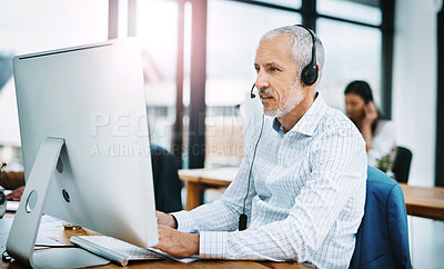 Buy stock photo Mature man, computer and call centre agent in coworking office, crm and consultant for support. Male person, headset and telemarketer for sale service, advisor and virtual assistant for customer care