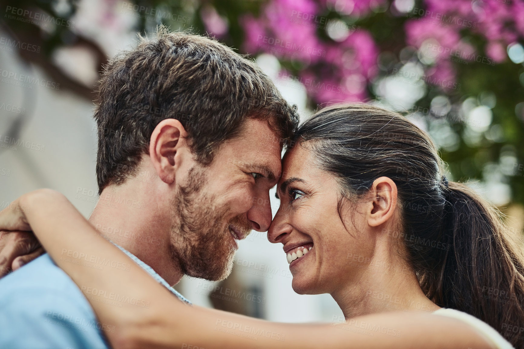 Buy stock photo Happy couple, forehead and hug in city on holiday, marriage commitment and travel to Greece. People, outdoor date and embrace for security in relationship, bonding and together on honeymoon weekend