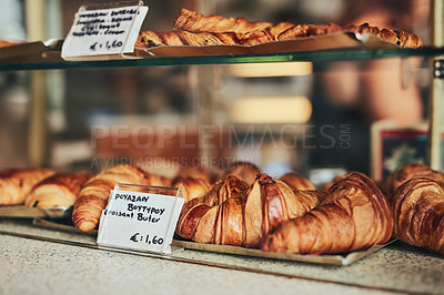 Buy stock photo Croissant, display and menu items in bakery for food, authentic treat and sale in service industry. French pastry, glass and choice in small business with option, baked goods and selection in Europe