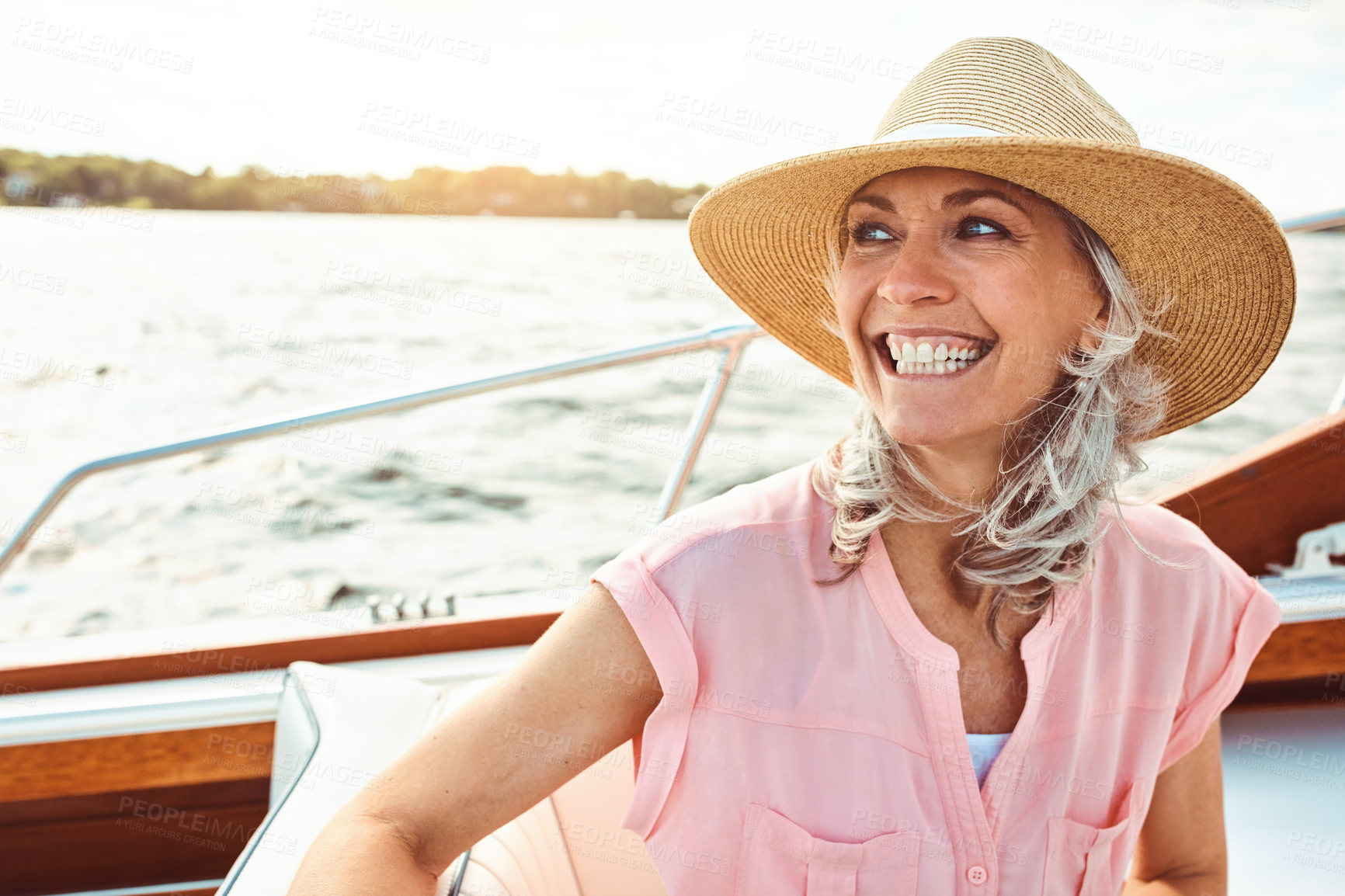 Buy stock photo Adventure, freedom and happy with mature woman on yacht for sailing, travel and summer vacation. Smile, journey and excited with tourist and relaxing on deck of boat for tropical, cruise and holiday