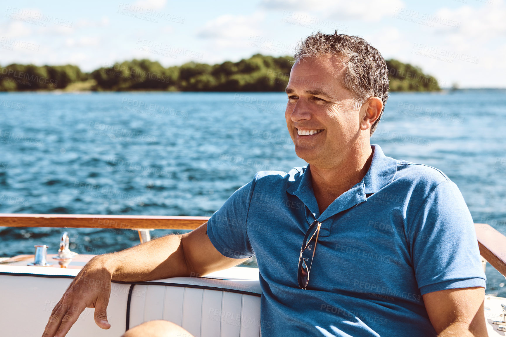 Buy stock photo Mature man, boat and vacation with thinking for retirement, smile on water cruise for future plan. Male person, yacht or thoughtful for pension goal on summer holiday, happy trip on ocean in Bali