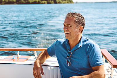 Buy stock photo Mature man, boat and travel with thinking for retirement, smile on water cruise for future plan. Male person, yacht or thoughtful for pension goal on summer vacation, happy trip on ocean in Bali