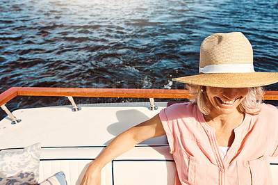 Buy stock photo Mature woman, retirement and yacht cruise for travel, leisure and holiday on ocean with relax. Female person, journey and happy on luxury boat at sea for view, vacation or tropical adventure sailing