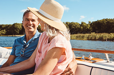 Buy stock photo Boat, luxury or travel with mature couple at sea together for holiday, getaway or vacation for retirement. Cruise, love or yacht with smile of man and woman on water for bonding, romance or voyage