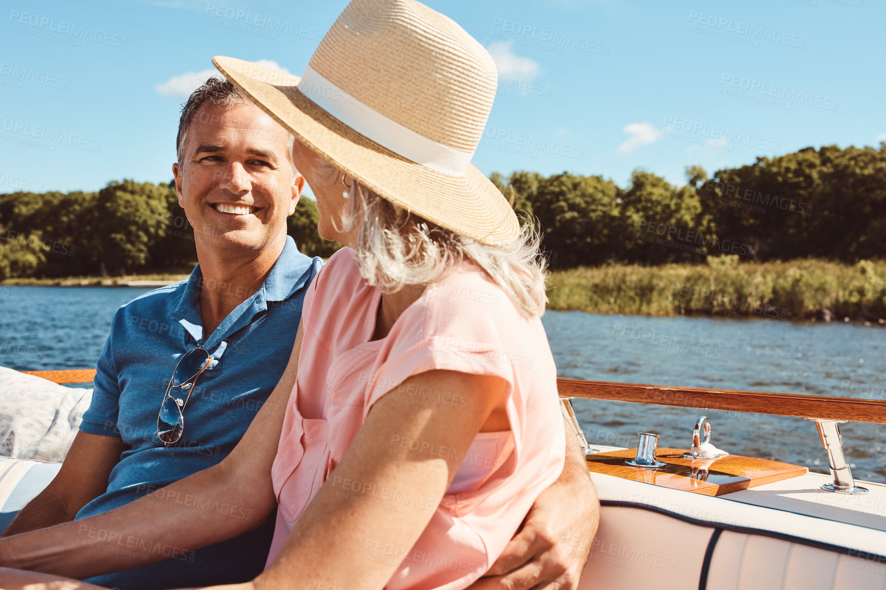 Buy stock photo Boat, luxury or travel with mature couple at sea together for holiday, getaway or vacation for retirement. Cruise, love or yacht with smile of man and woman on water for bonding, romance or voyage