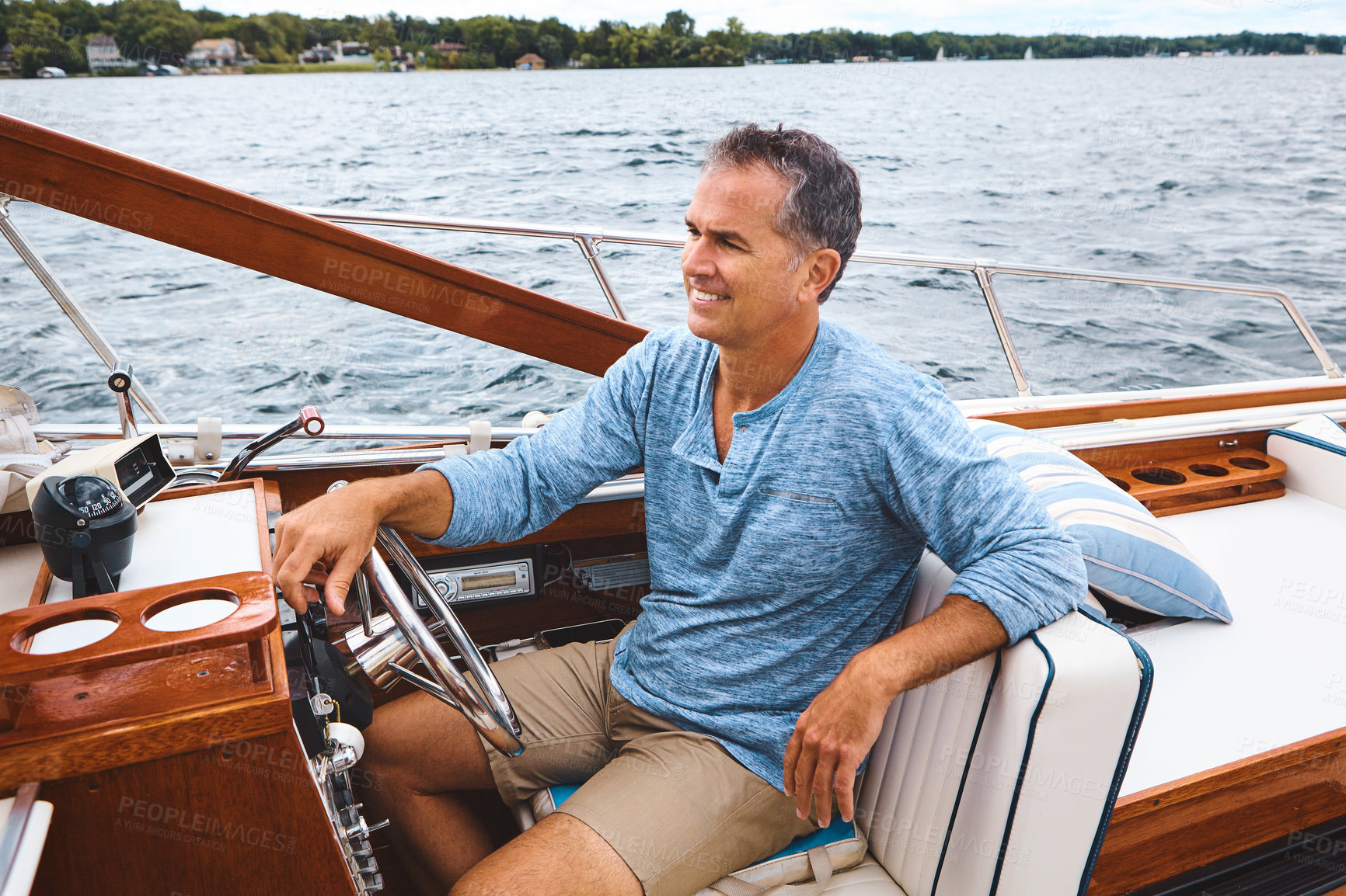 Buy stock photo Luxury, sailor and boat on water for retirement, leisure and investment for holiday. Wealthy, happiness and mature man on vacation for sailing, adventure and transportation on lake in summer
