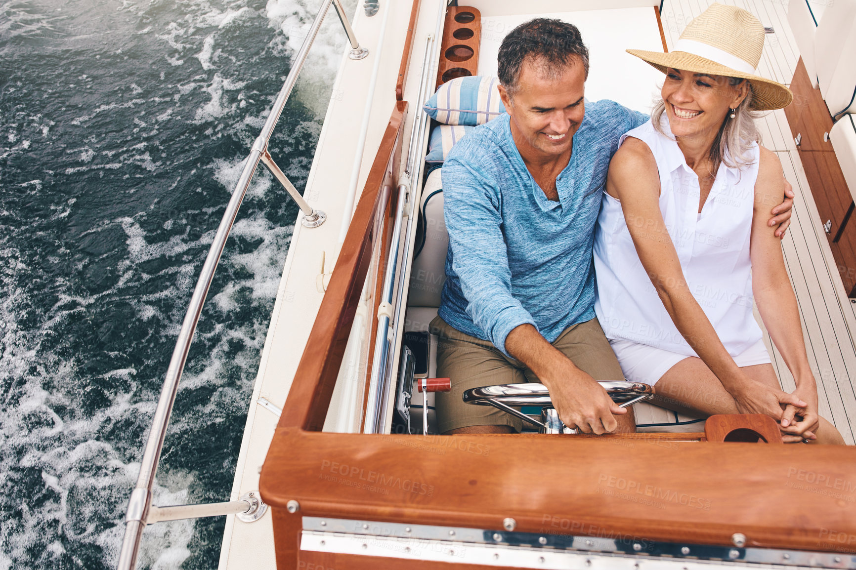 Buy stock photo Boat, love and romance with mature couple on ocean or sea from above for travel and vacation. Date, holiday or luxury with man and woman riding in yacht together for adventure, journey or trip