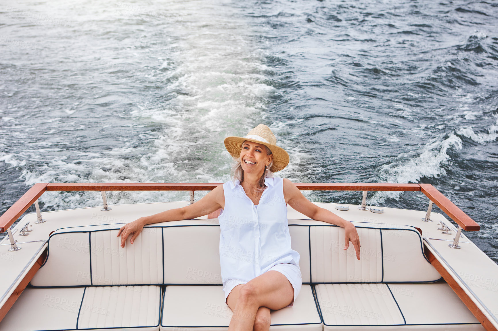 Buy stock photo Mature woman, boat and travel with thinking for retirement, smile on water cruise for future plan. Female person, yacht or thoughtful for pension goal on summer vacation, happy trip on ocean in Bali