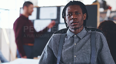 Buy stock photo Portrait of a young businessman sitting in an office