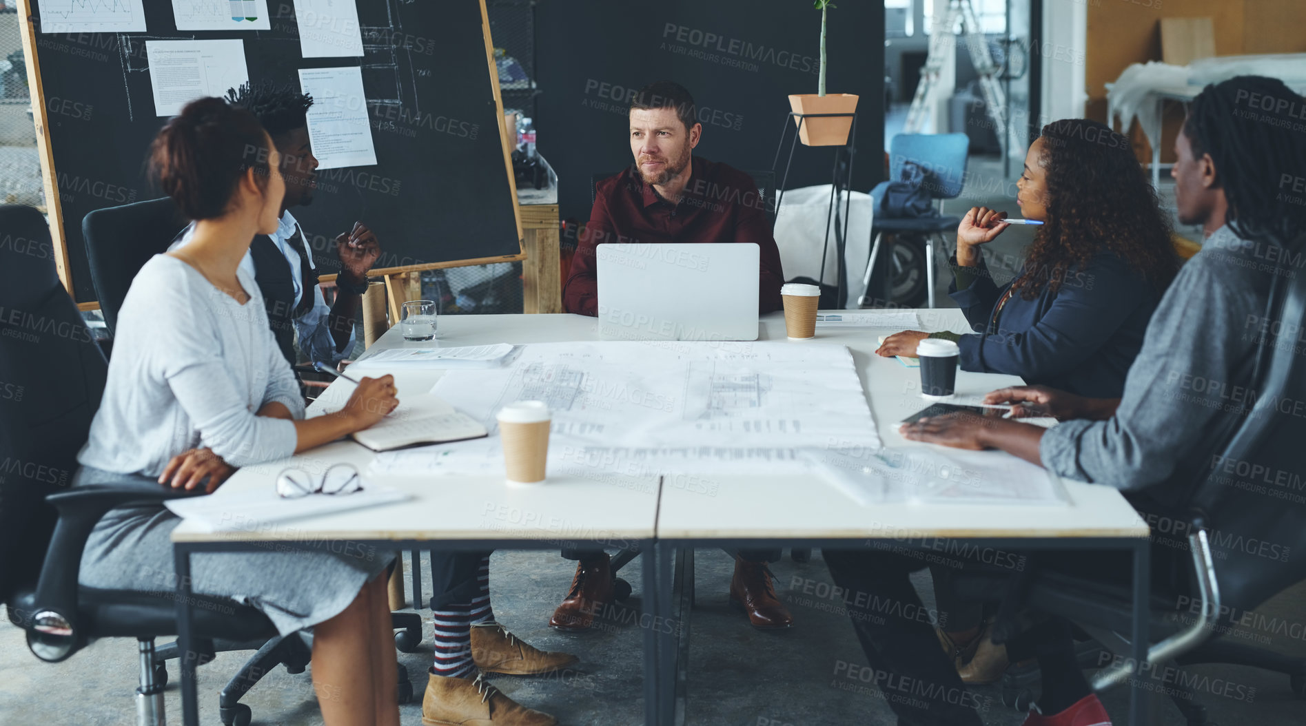 Buy stock photo Cropped shot of a group of creative businesspeople meeting in their office