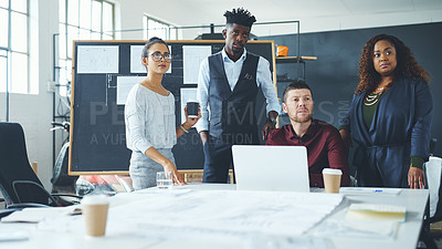 Buy stock photo Cropped shot of a group of creative businesspeople meeting in their office