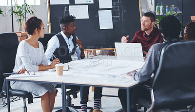 Buy stock photo Cropped shot of a group of creative businesspeople meeting in their office