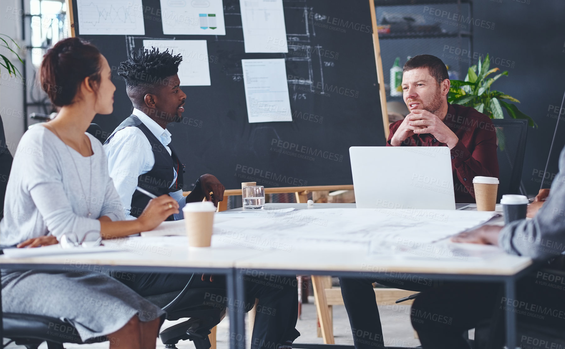 Buy stock photo Cropped shot of a group of creative businesspeople meeting in their office