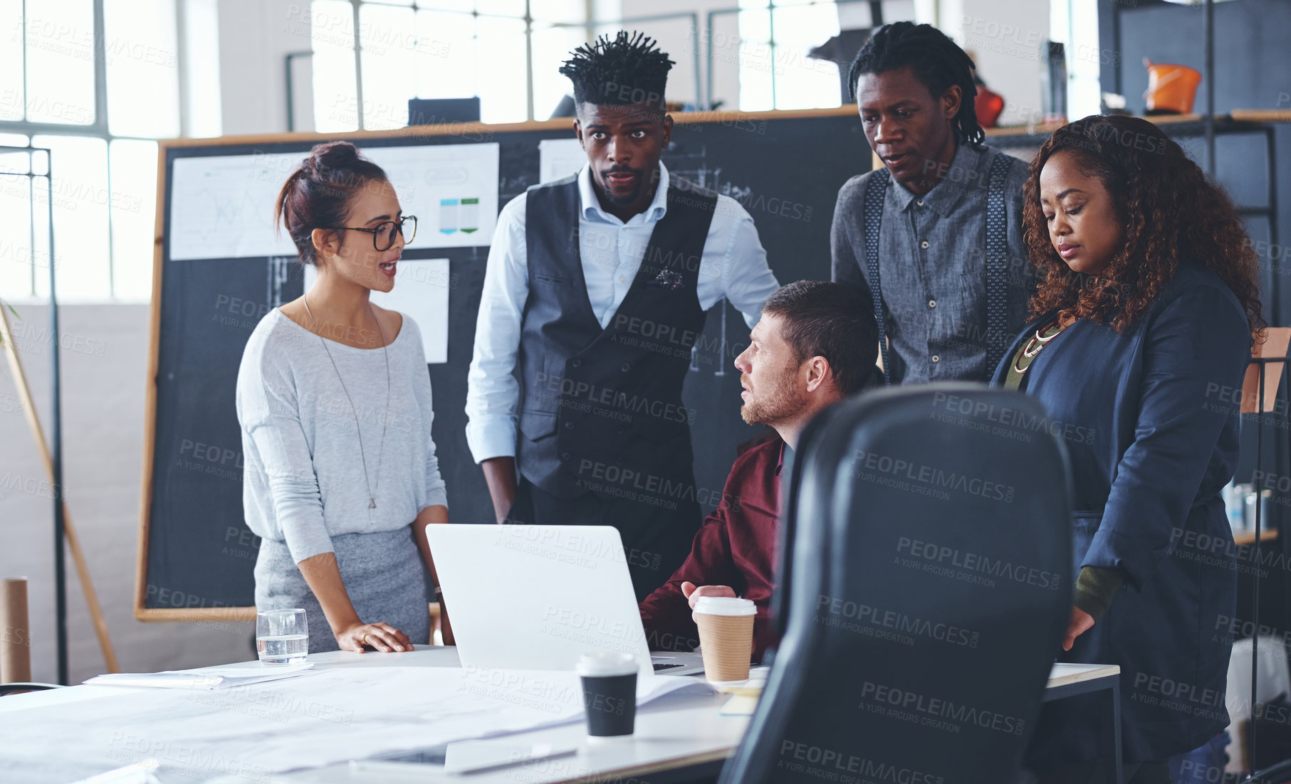 Buy stock photo Cropped shot of a group of creative businesspeople meeting in their office