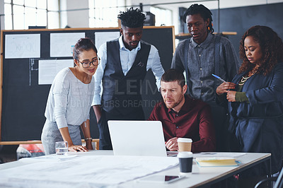 Buy stock photo Cropped shot of a group of creative businesspeople meeting in their office