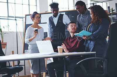 Buy stock photo Cropped shot of a group of creative businesspeople meeting in their office