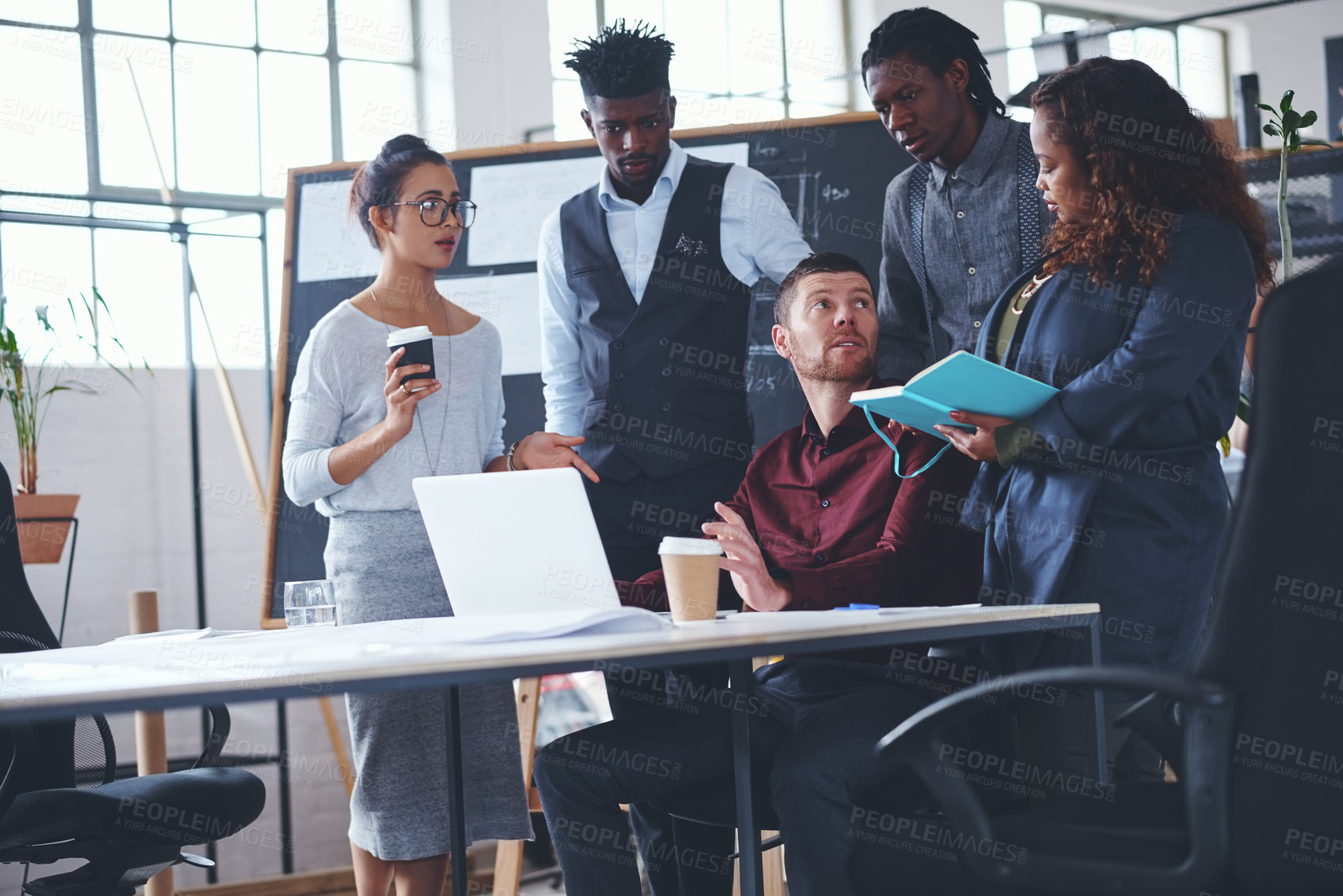 Buy stock photo Cropped shot of a group of creative businesspeople meeting in their office