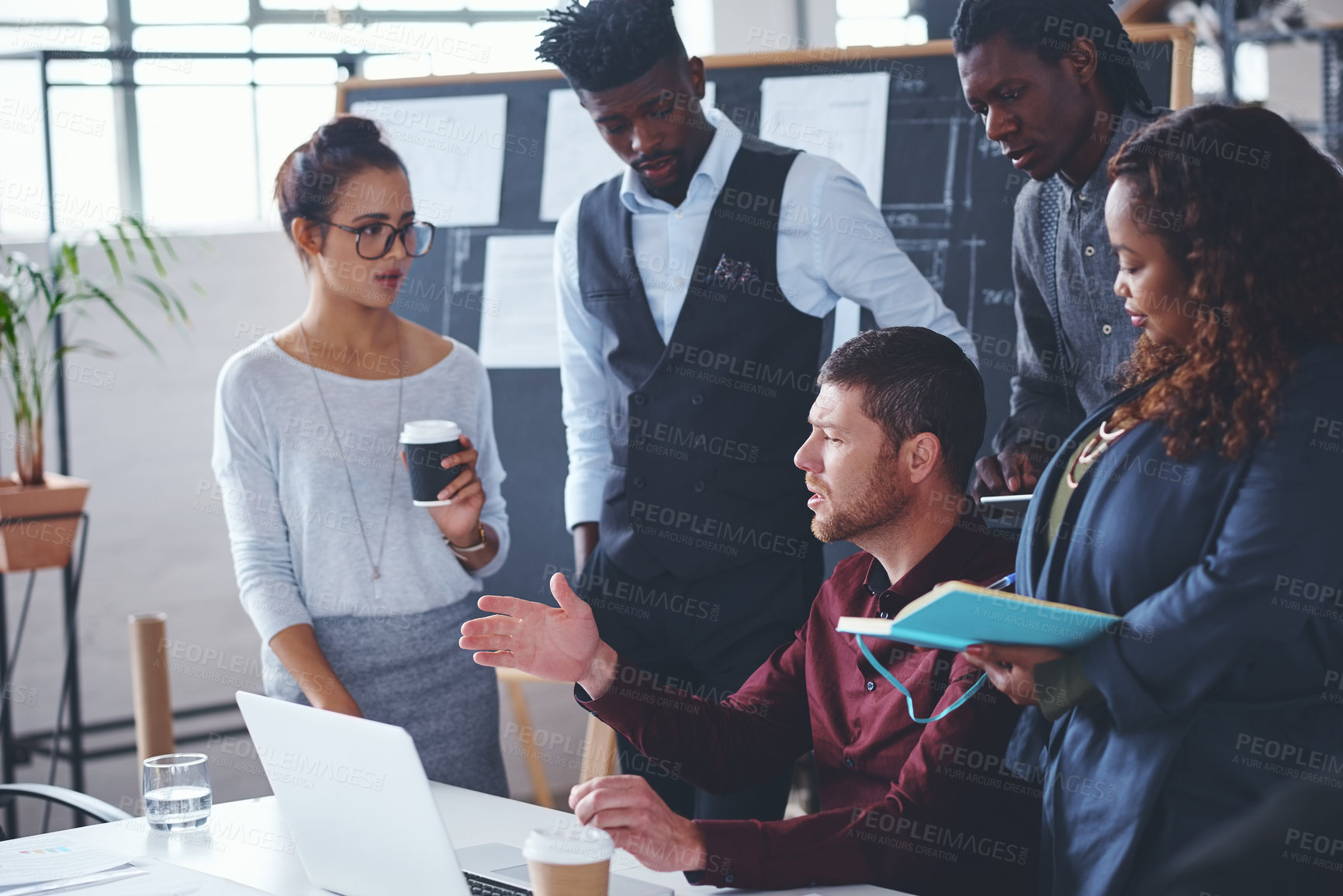 Buy stock photo Cropped shot of a group of creative businesspeople meeting in their office