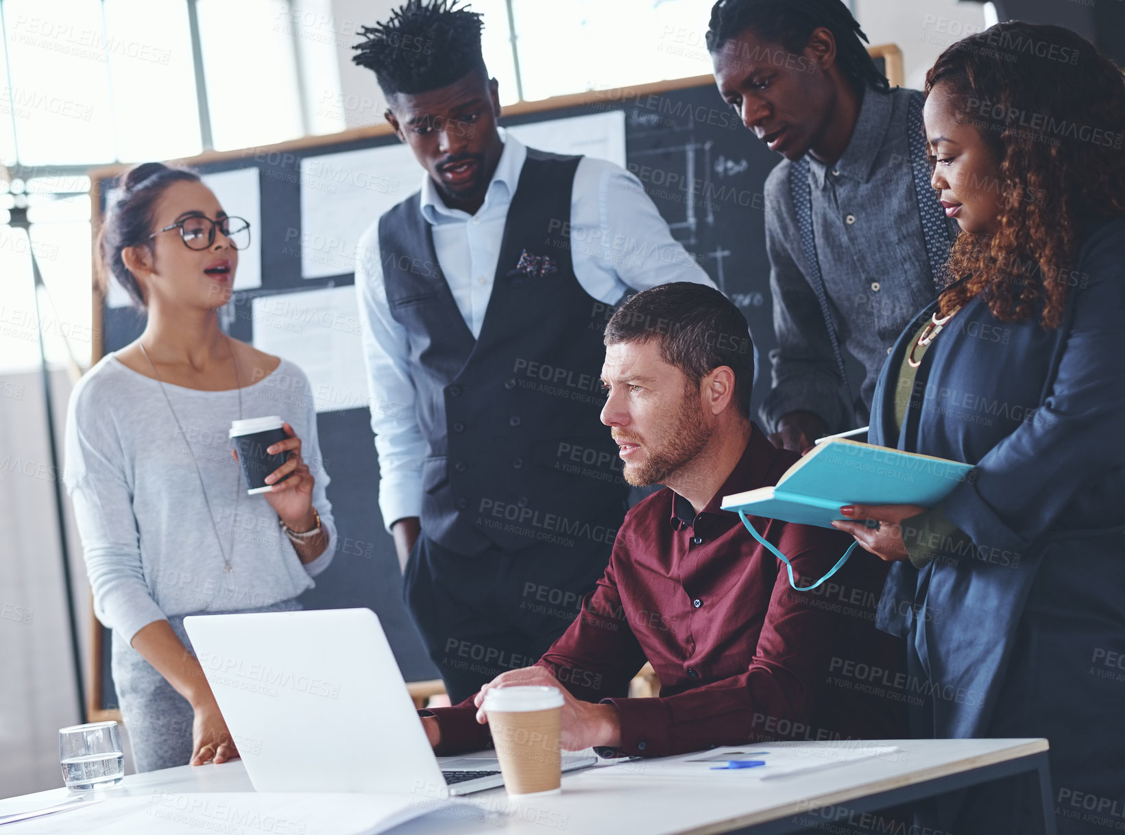 Buy stock photo Cropped shot of a group of creative businesspeople meeting in their office