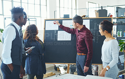 Buy stock photo Cropped shot of a young creative businessman doing a presentation in the office