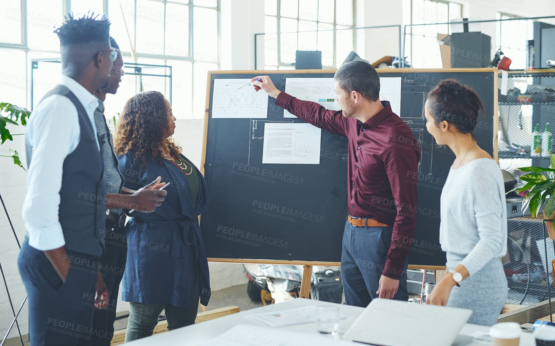 Buy stock photo Cropped shot of a young creative businessman doing a presentation in the office