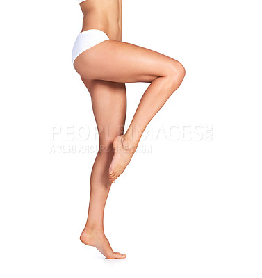 Buy stock photo Studio shot of an unrecognizable young woman in her underwear posing against a white background