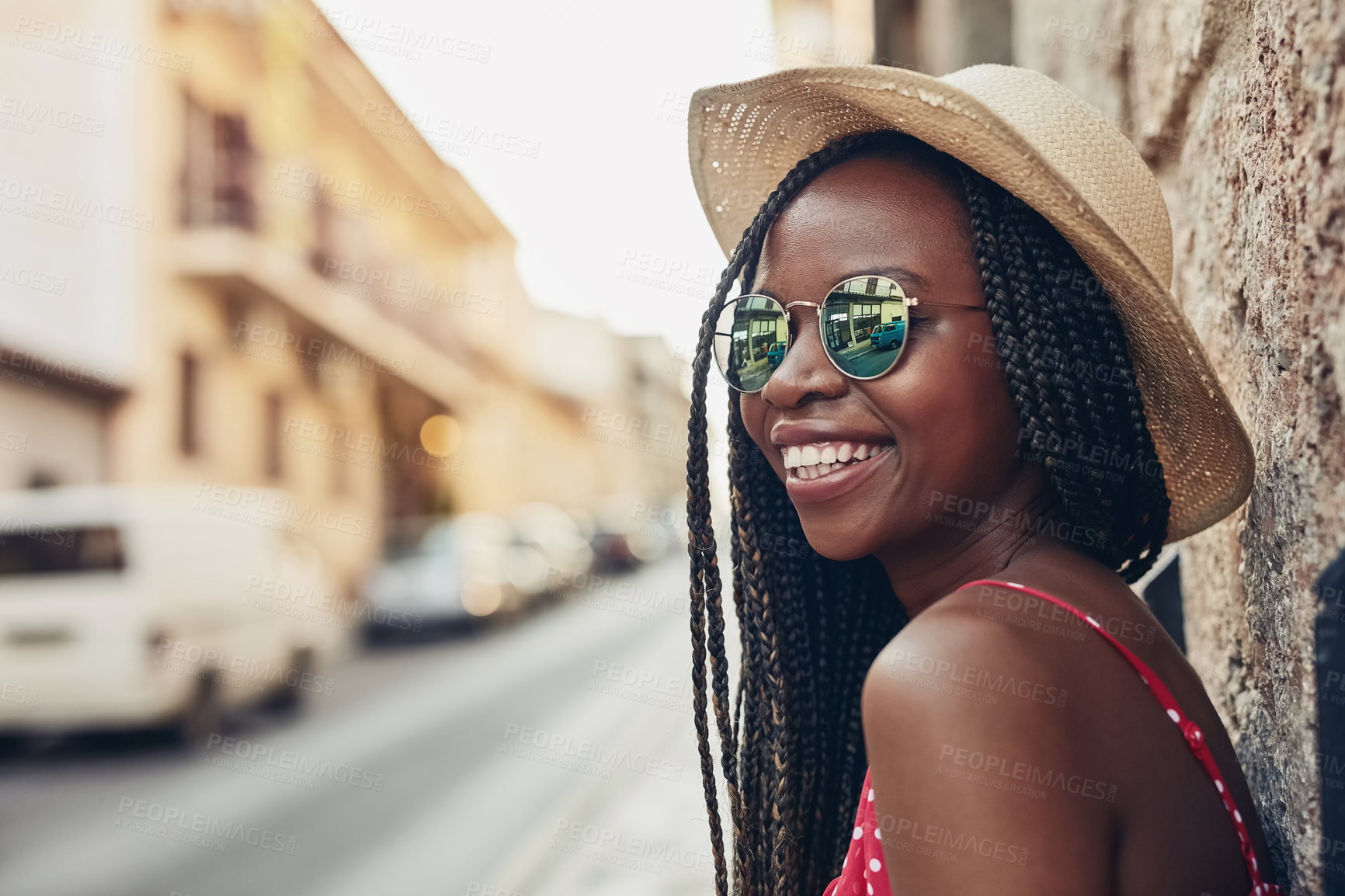 Buy stock photo Shot of a beautiful young woman spending her day out exploring a foreign city