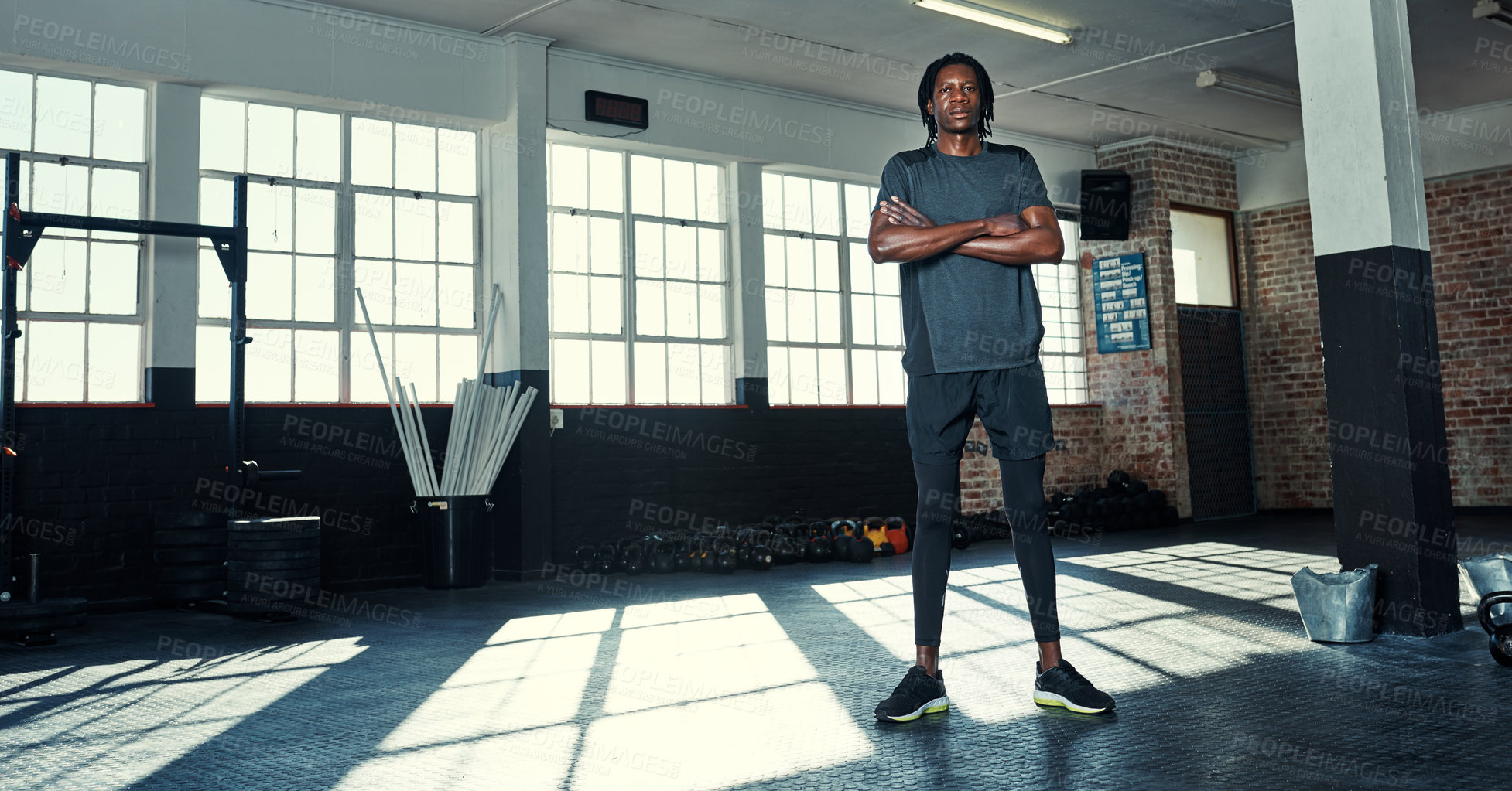 Buy stock photo Shot of a young man in a gym