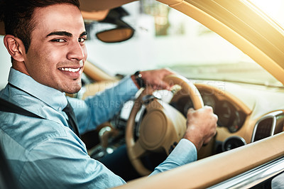 Buy stock photo Portrait of a young businessman driving a car