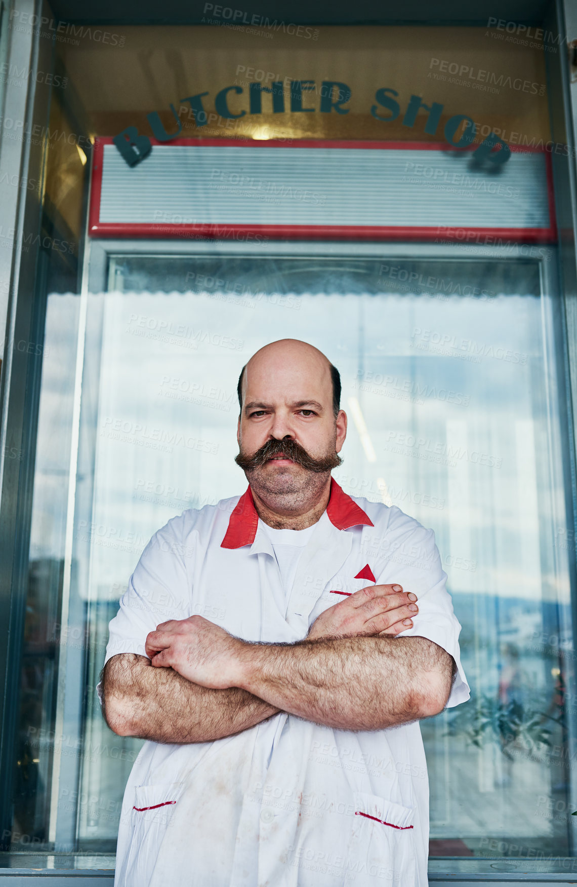 Buy stock photo Portrait, man and butcher at market with arms crossed at small business startup. Worker, confidence and meat seller at retail store with face for pride of professional owner outdoor at shop in USA