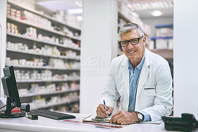 Buy stock photo Pharmacy, man and writing at counter for healthcare, medicine and retail or medical services in portrait. Happy and mature doctor or pharmacist with documents, clipboard or drugs checklist for advice