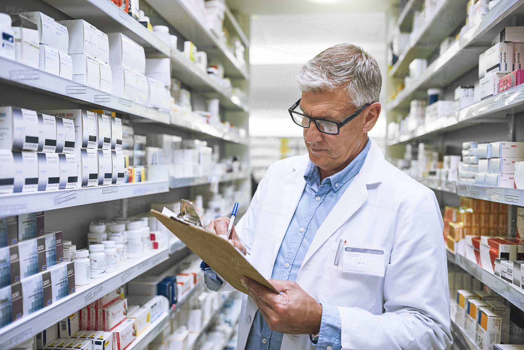 Buy stock photo Pharmacy, medicine and checklist with man writing in drug store for notes, inspection and inventory. Medical, healthcare and pills with male pharmacist in clinic for mature expert or wellness product