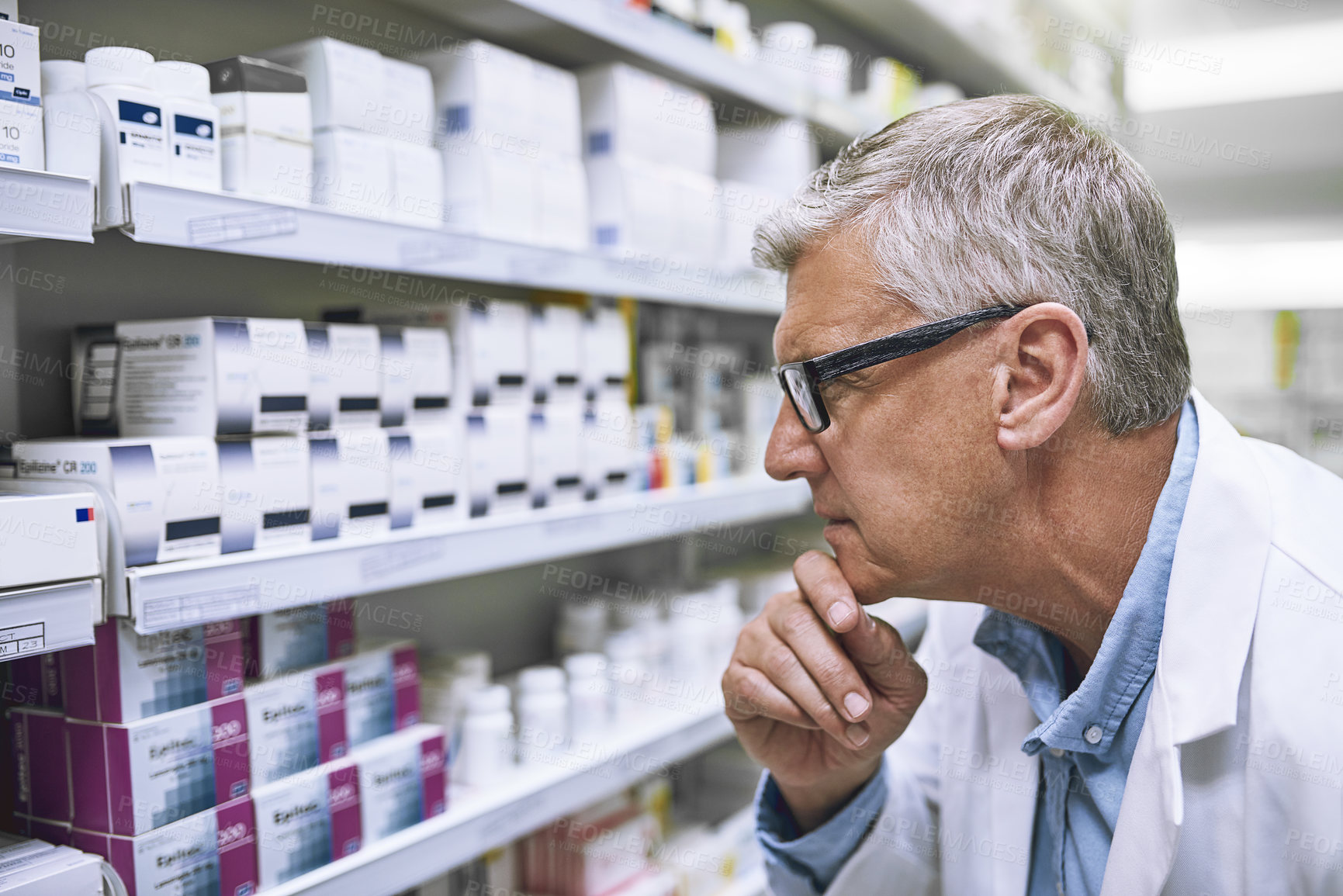 Buy stock photo Pharmacy, medicine and thinking with man at shelf in drug store for search, inspection and inventory. Medical, healthcare and pills with senior male pharmacist for expert, wellness and product
