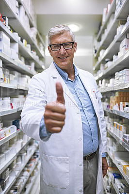Buy stock photo Senior man, doctor and thumbs up at pharmacy for winning, success or approval at clinic store. Portrait of happy elderly male or medical expert showing thumb emoji, yes sign or like in pharmaceutical