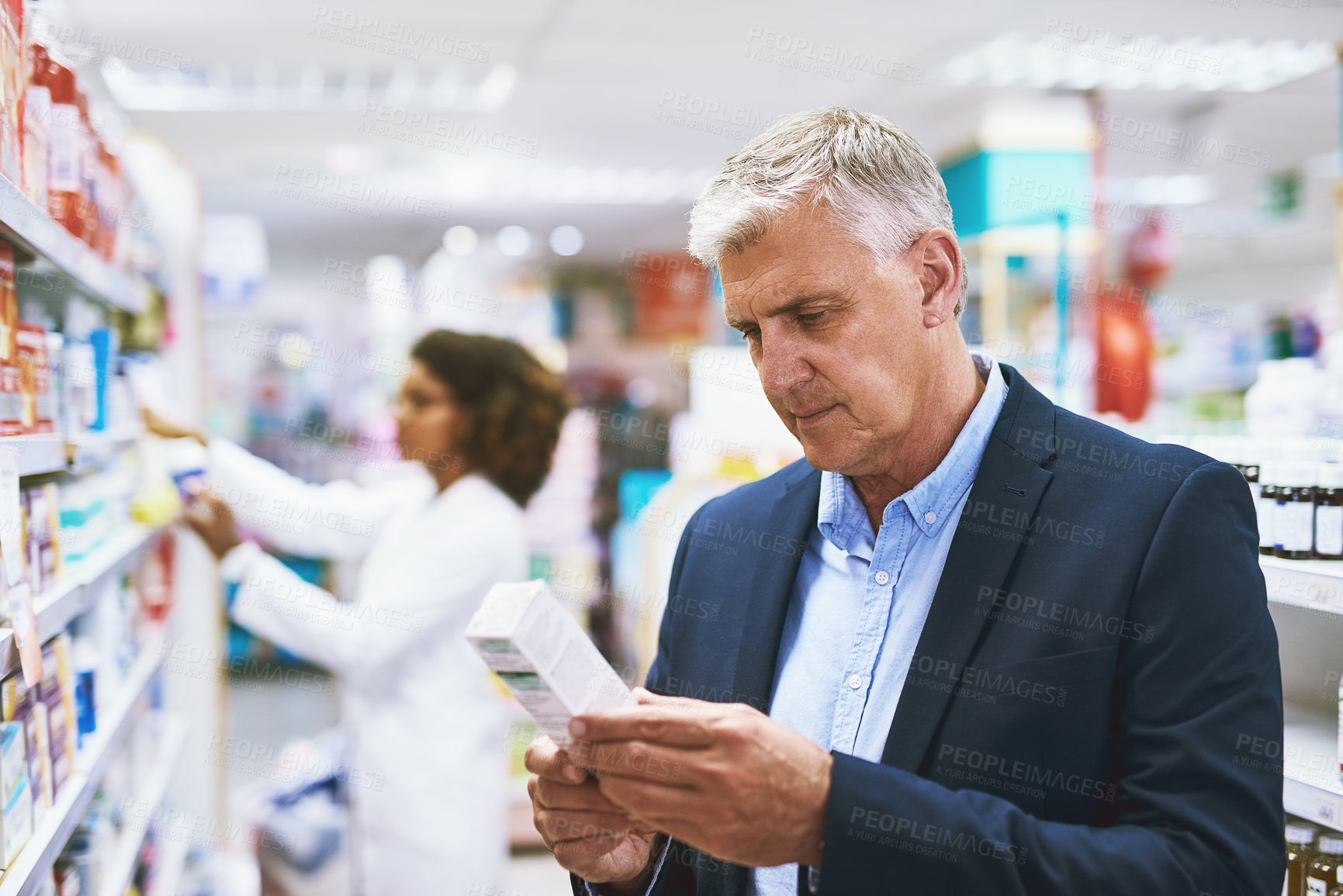 Buy stock photo Senior man shopping, reading on medicine or customer in pharmacy for retail healthcare pills or product. Information, businessman or mature customer searching for medication or medical drugs on shelf