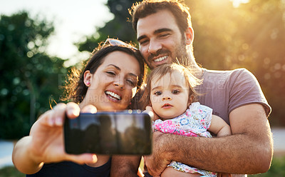 Buy stock photo Shot of a young family outdoors