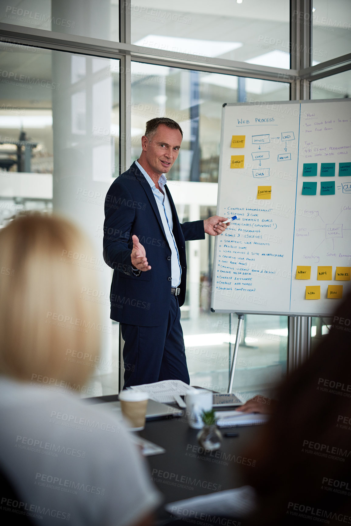 Buy stock photo Shot of businesspeople having a meeting in the office