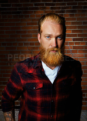 Buy stock photo Man, portrait and confident style by brick wall, pride and flannel or plaid style for trend. Male person, serious face and farmer or casual outfit for aesthetic, designer clothes and weekend travel