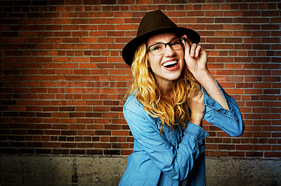 Buy stock photo Woman, portrait and confident style by brick wall, pride and glasses or fashion outfit. Happy person, accessories and gen z or casual designer aesthetic, outdoor clothes and spotlight for laugh