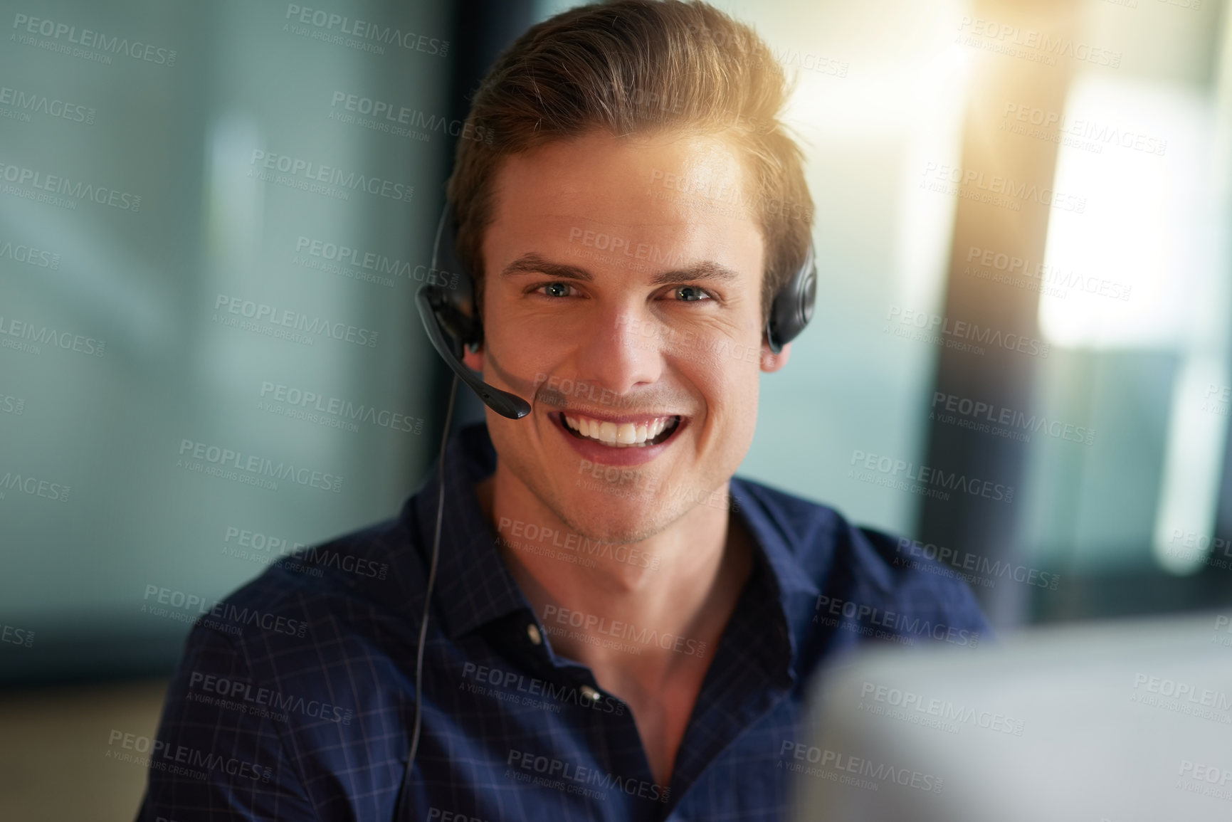 Buy stock photo Shot of a young male agent working in a call center