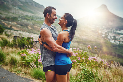 Buy stock photo Hug, couple and fitness in nature with love, happiness and exercise on mountain trail. Man, woman and together at sunrise with smile, training and support in sportswear for motivation or marathon