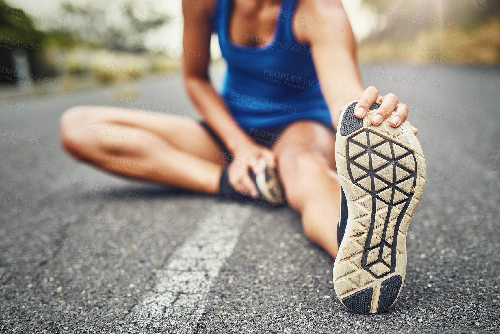 Buy stock photo Stretching leg, floor and woman in road with fitness for running challenge, marathon training or cardio in morning. Runner, warm up and athlete getting ready for workout, exercise or sports activity