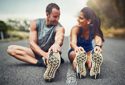 Buy stock photo Fitness, health and coach with athlete for stretch on ground before running training for marathon preparation. Sports, man and woman with cardio warm up for workout and exercise with personal trainer