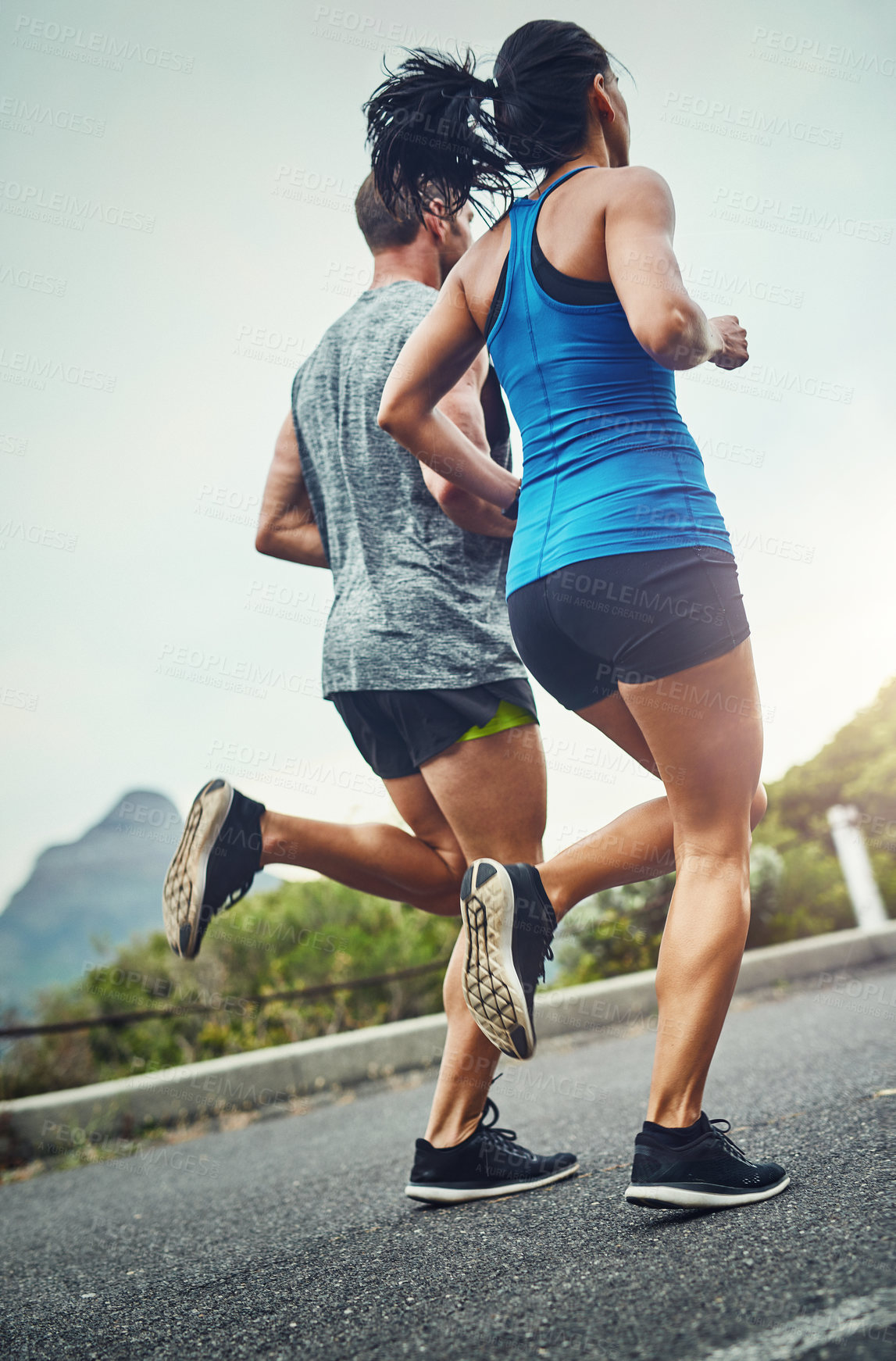 Buy stock photo Couple, people and running for fitness, workout and exercise for health in Brazil. Relationship, support and outdoor with routine or activity for wellbeing, wellness and self care in road with trust