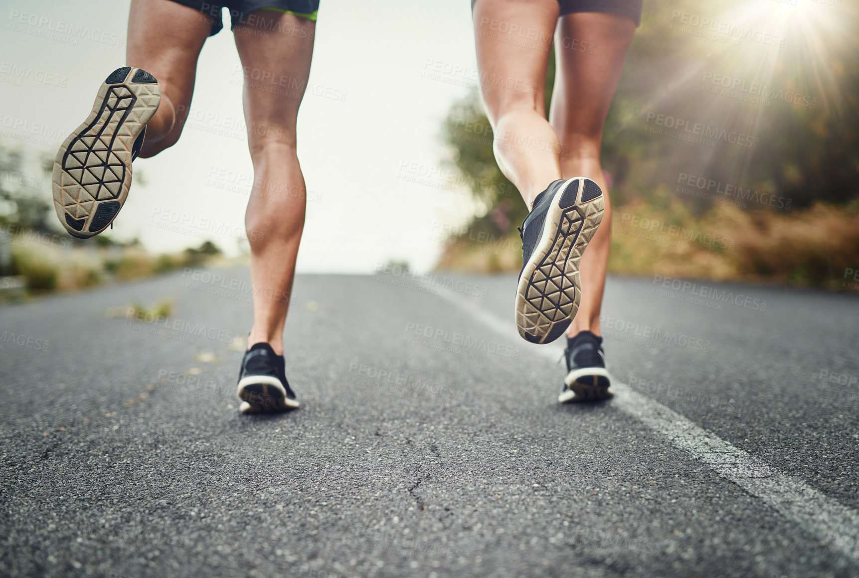 Buy stock photo Shot of an unrecognizable couple training for a marathon outdoors