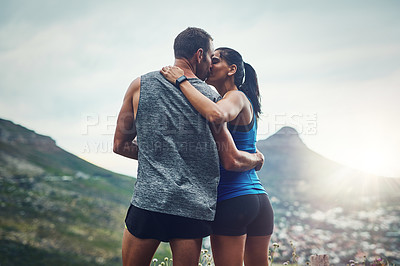 Buy stock photo Fitness, couple and kiss on mountain for workout, outdoor marathon and training as team. Wellness, man and woman together outside in nature with love for health, exercise and adventure or cardio