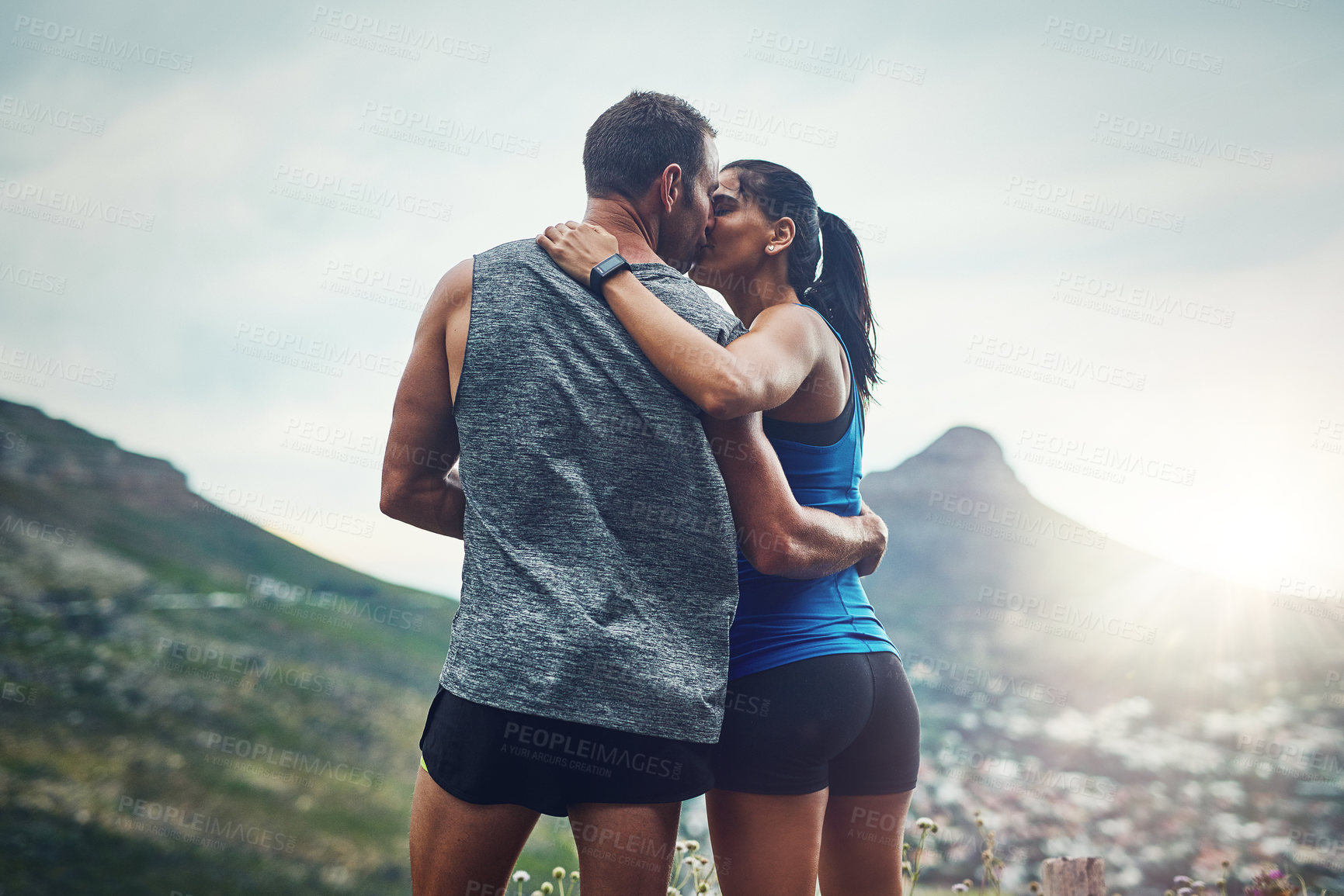 Buy stock photo Fitness, couple and kiss on mountain for workout, outdoor marathon and training as team. Wellness, man and woman together outside in nature with love for health, exercise and adventure or cardio