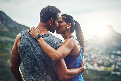 Buy stock photo Shot of a young attractive couple training for a marathon outdoors