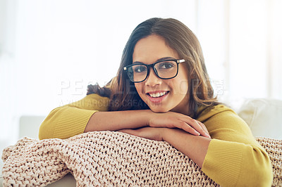 Buy stock photo Shot of a beautiful young woman relaxing at home