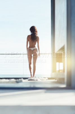 Buy stock photo Rearview shot of a young woman standing outside in her panties